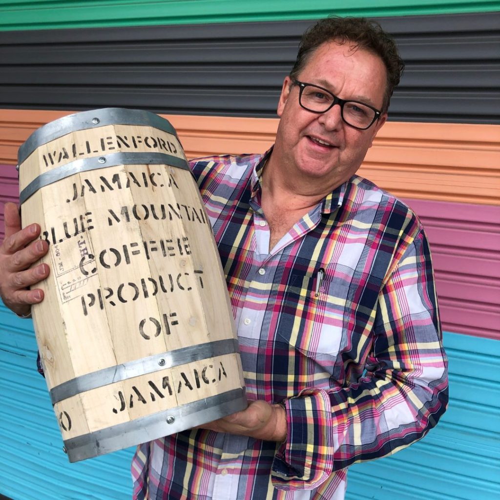 Master roaster David holding a barrel of Jamaica Blue Mountain